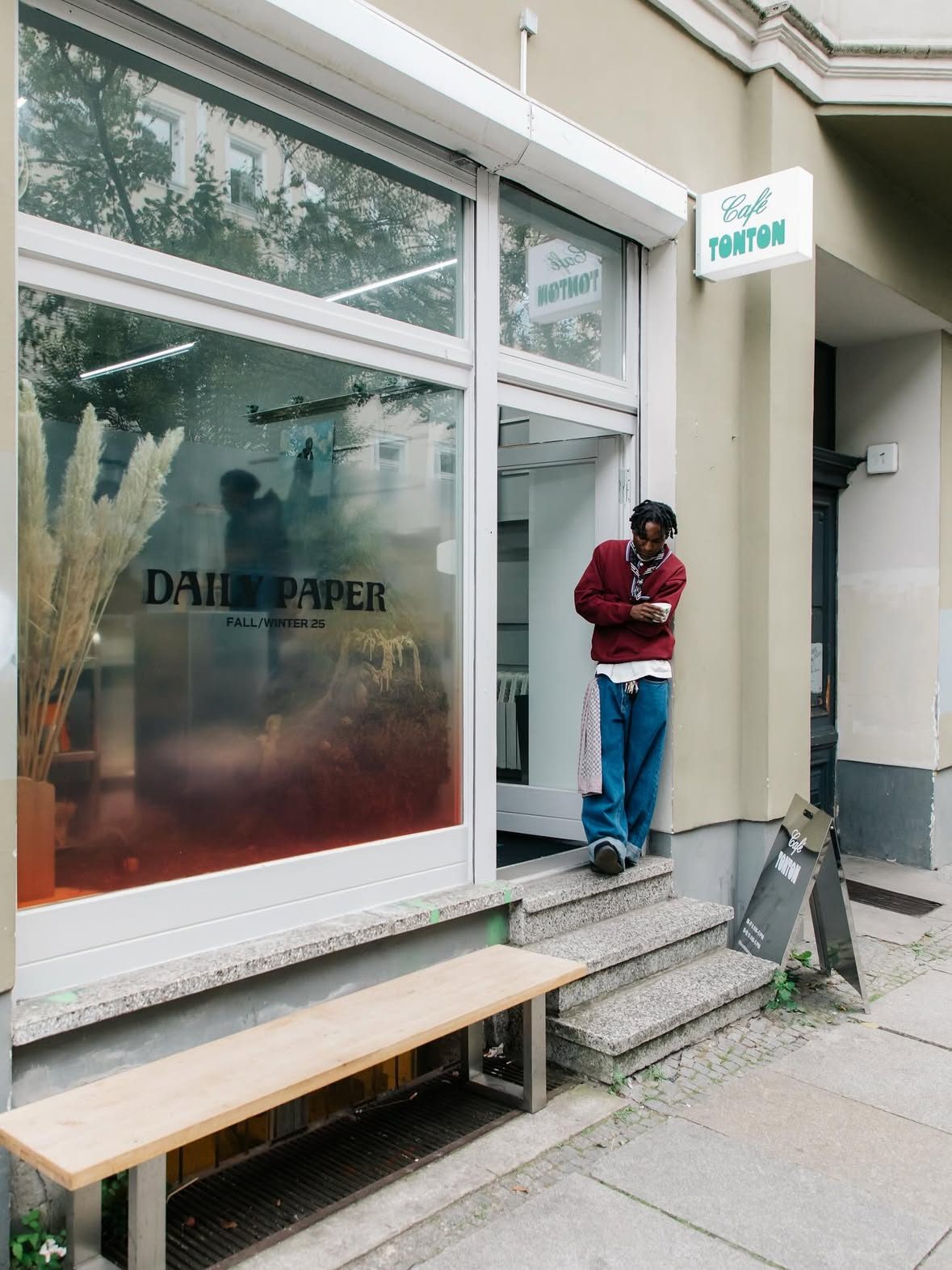 The café shopfront with the Daily Paper Fall/Winter 25 decal on the window